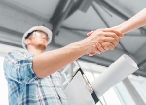 Contractor shaking hands with a homeowner
